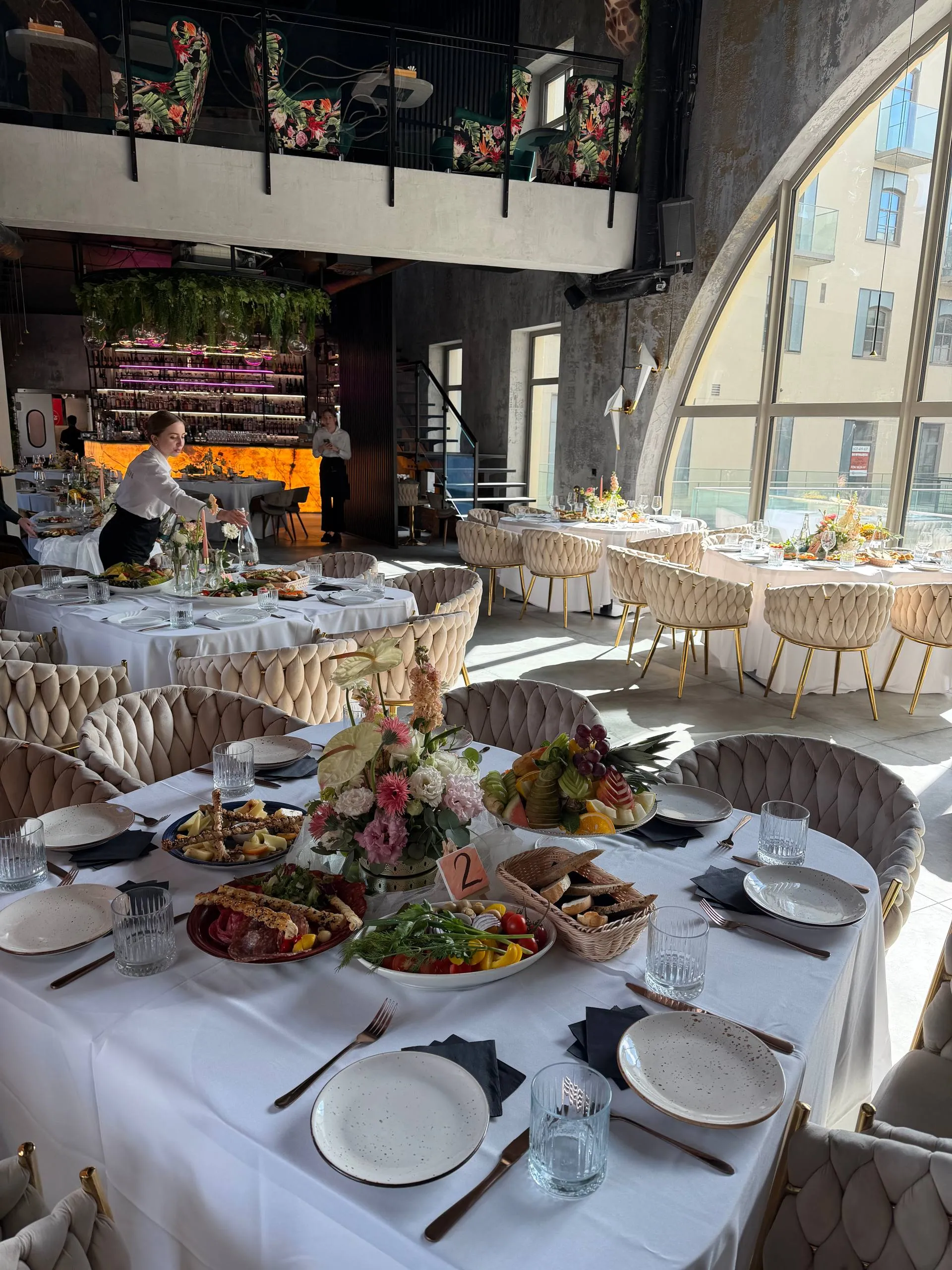 Selection interior with mezzanine, bar and green walls during a banquet in Wrocław